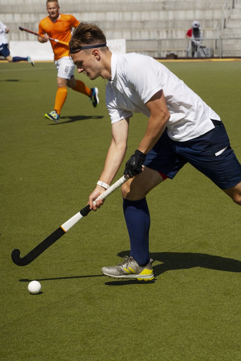 field-hockey-player-training-practicing-sport-grass